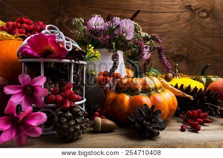 Fall Arrangement With Turban Squash, Pink And Purple Flowers