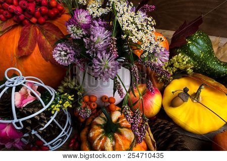 Thanksgiving Decor With Yellow, Green, Orange Squash And Clower