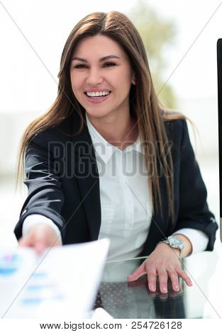 close up.business woman giving a colleague a financial documen