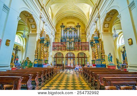 Krakow, Poland - June 11, 2018: The Small Pipe Organ Decorated With Gilden Carved Elements Located I
