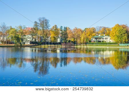 Pond In Riga, District Agenskalsns. Autumn, Yellow Tree Leaves, Lake And Reflection. 2017