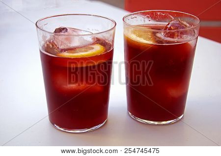 Two Glasses With Vine Cocktail Tinto De Verano, Lemon And Ice, Summer, Spain