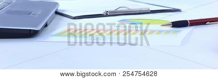 Calculator And A Marketing Scheme On The Table From A Businessm