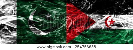 Pakistan Vs Sahrawi Smoke Flags Placed Side By Side. Thick Colored Silky Smoke Flags Of Pakistan And