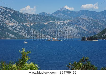 Boko-kotorska Bay In Montenegro. Epic View Of The Island Of Saint George Island And The Roman Cathol