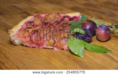 A Piece Of Traditional Plum Cake. Fresh Plum On A Wooden Tray