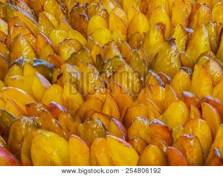 Amber Juicy Quarters Of Fresh Summer Plum. Background