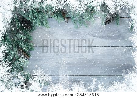 Christmas Firbranch With Cones On Old Wooden Rustic Background With Copy Space For Text, Toned
