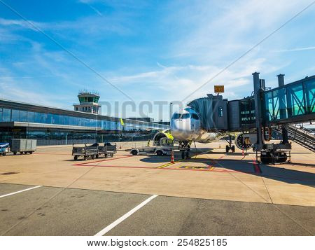 Riga, Latvia - July 8, 2018: Airbaltic airlines airplane boarding at the domestic airport at day time