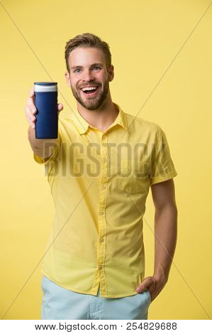 Man Show His Favorite Shower Gel Or Lotion For Body. Guy Satisfied With Shower Gel. Man Bearded Styl
