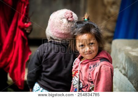 GHALEGAUN, NEPAL - CIRCA MAY 2018: Young Nepali girl looking at the camera.