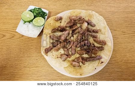 Taco De Tripitas. Tortilla With Beef Tripe Or Chunchulo (chunchurria). Traditional Mexican Food Dish