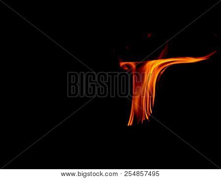 A Dancing Fire In A Fireplace On A Black Background, A Fire Texture, A Red Flame.