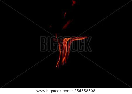 A Dancing Fire In A Fireplace On A Black Background, A Fire Texture, A Red Flame.