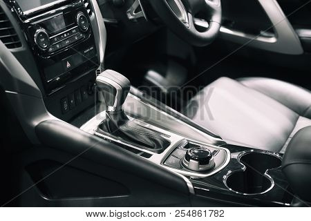 Luxury Of Car Interior At Transmission Shift Gear Area. Modern Car Interior, Gearstick Radio And Cup