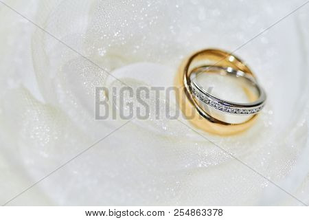 Close-up And Selective Focus On The Diamond Head With Shallow Deph Of Field Of The Couple Rings, Pla