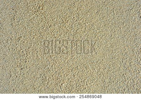 Yellow Bright Background, Construction Wall With Very Small Glass Stones Matte White And Gray With A