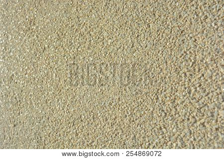 Yellow Bright Background, Construction Wall With Very Small Glass Stones Matte White And Gray With A