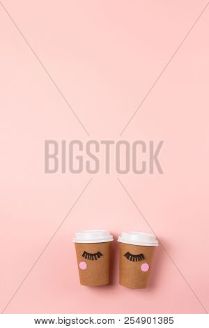 Two Craft Cups To Do On The Pastel Pink Background. Decorated With Funny Cute Paper Eyes. Wake Up An