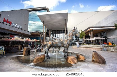 Johannesburg, South Africa, 18 August - 2018: Entrance To Mall With Sculpture Of Animals In Foregrou