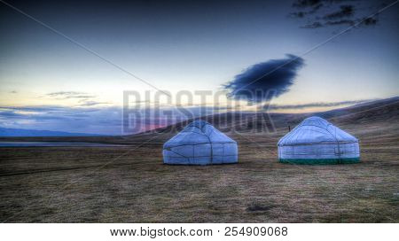 Cloud Over The Yurts At The Shore Of Song Kol Lake At The Dawn At Kyrgyzstan