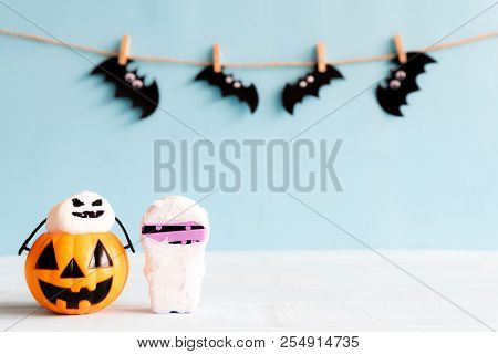 Halloween Crafts, Orange Pumpkin, Ghost , Mummy And Spide, Bat On Wooden Table With Copy Space For T