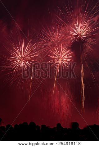 Colourful Fireworks With A Crowd Of People