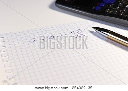 A One Long Math Problem Who Calculating With Help Calculator At Home. Homework For Math Lesson