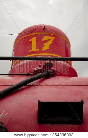 The Detail Of A Train With A Number On The Chimney