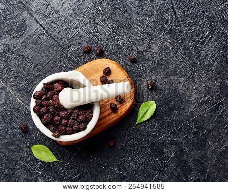 Dried Hawthorn Fruits On Black Background. Top View Of Crataegi Fructus.