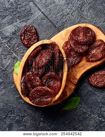 Dried Brown Apricots On Gray Background. Top View.