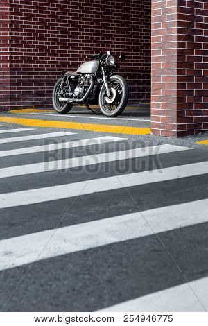 Caferacer Motorcyle Parking Near Brick Wall Of Industrial Building. Everything Is Ready For Having F