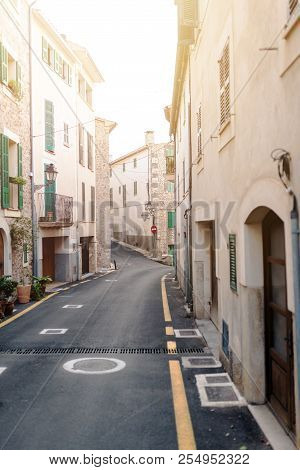 Narrow Street In Small Village Of Banyalbufar On Balearic Island Of Mallorca, Spain