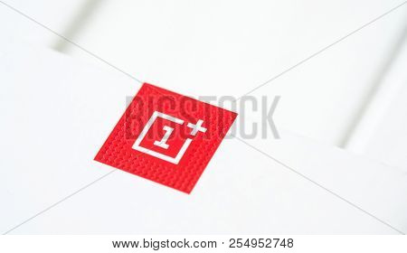 Khakiv, Ukraine - 14 August 2018: Red square logotype of smartphone OnePlus 6 with white background