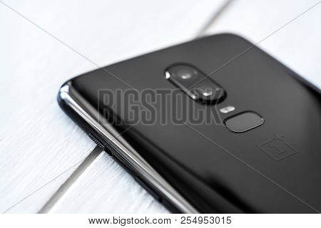 Khakiv, Ukraine - 14 August 2018: Modern Smartphone OnePlus 6 on the white wooden table