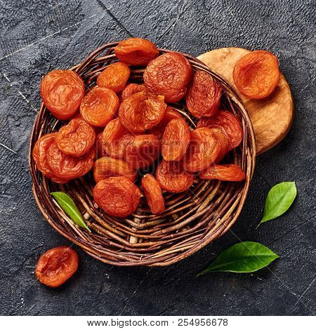 Dried Apricots On Gray Background. Top View.