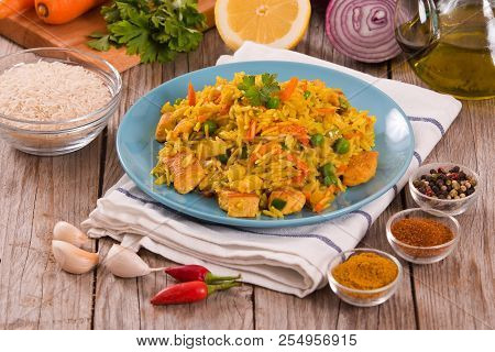 Nasi Goreng With Spices On Wooden Table.