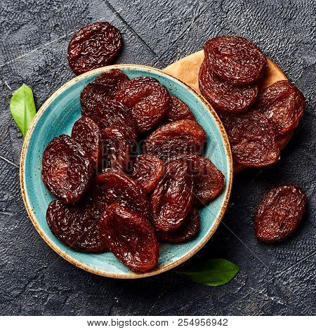 Dried Brown Apricots On Gray Background. Top View.
