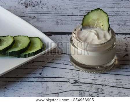 Cucumber Face Cream On White Wooden Background, Homemade Cosmetics