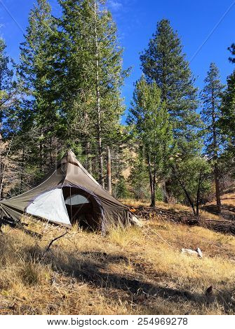 Tent Camping In Sawtooth Mountain Range, Idaho, Usa. Beautiful Rugged Terrain With Grassland And Pin