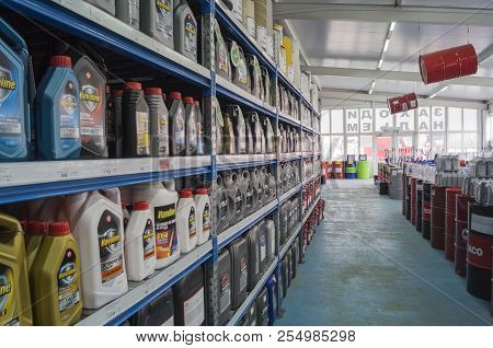 Omsk, Russia - August 22, 2018: Shop Window With Goods, Cans Of Motor Oil Of Different Manufacturers