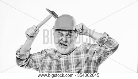 Man Bearded Laborer Wear Helmet Hold Hammer. Repair Workshop. Repair Concept. Senior Foreman Worker.