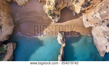 Waves In The Bay Between The Rocks In The Atlantic Ocean. Aerial View Taken By A Drone.