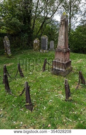 Balquhidder, Scotland  - September 17 2019: Close Up Fo A Grave With An Obelisk In The Local Cemeter