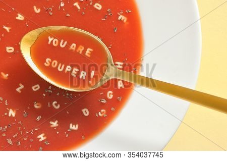 Tomato Soup With Letter Noodles On Spoon