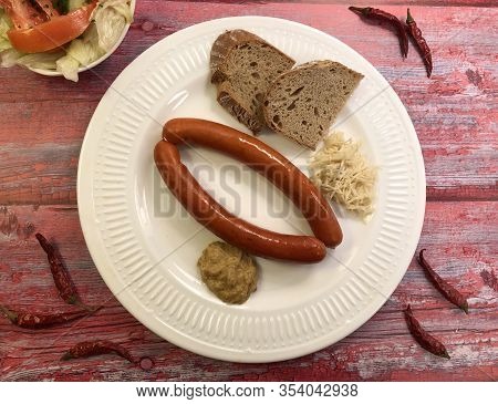 Debreziner Sausages With Mustard And Fresh Horseradish.