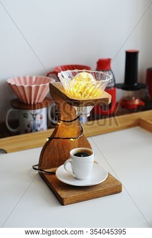 Creative Art Handmade Lamp Made Of Drip Coffee Station, V60 Dripper And Lights. Cup Of Black Coffee 