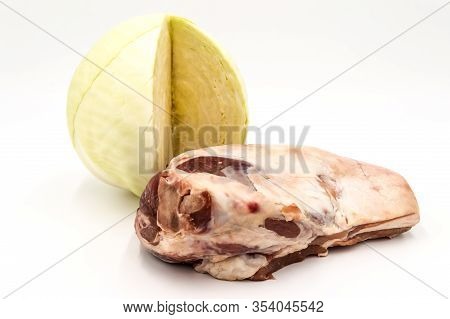 Lamb Shoulder And White Cabbage On A White Background