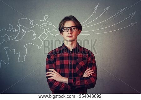 Concept Of Information Processing. Teenage Student Stands Arms Folded Looking To Camera As Mess Line