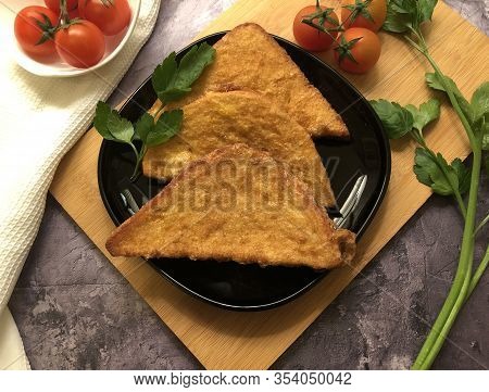 Crispy, golden french toast. Sliced white bread coated in beaten eggs and milk and fried.